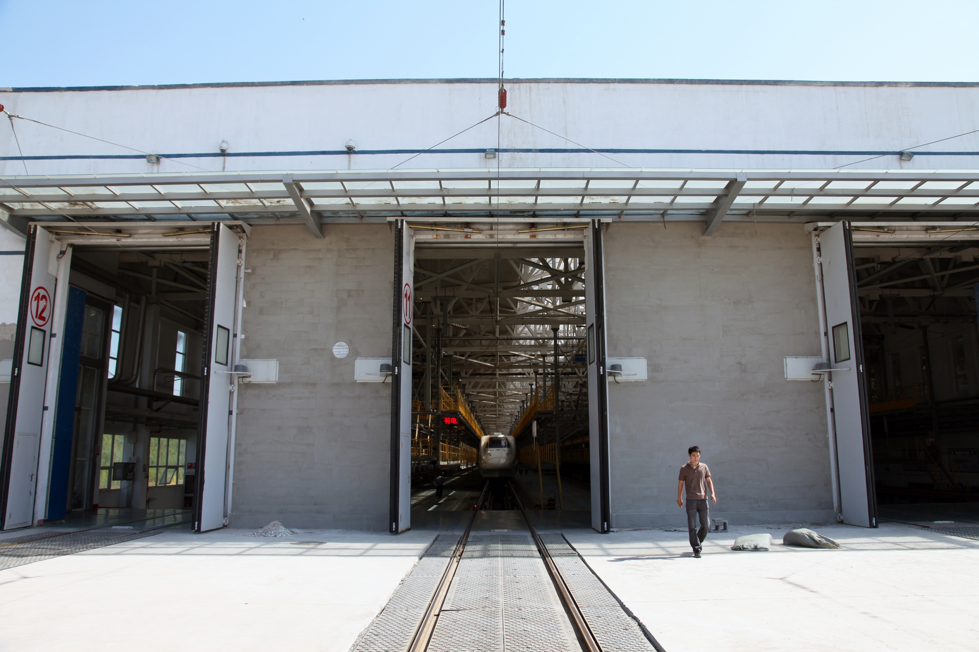 Large industrial electric folding door system